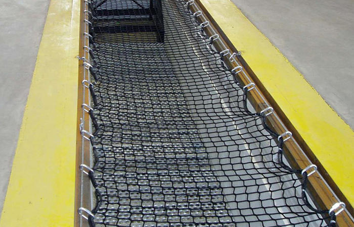 BayNets pit safety net system installed over a quick lube bay for OSHA safety compliance